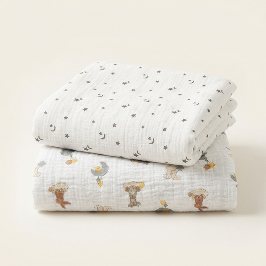 ​Organic muslin
swaddle blankets in white
grey yellow brown with
moon stars animal pattern
by Baby DukWear Inc.