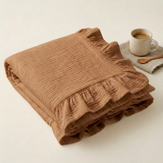Organic 4-layer
muslin adult throw
blanket in Camel, Brown
with ruffle border by
Baby DukWear Inc.
