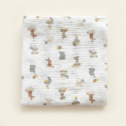 Premium organic cotton muslin swaddle blanket Dream Safari Animal Print folded for newborn nursery by Baby DukWear