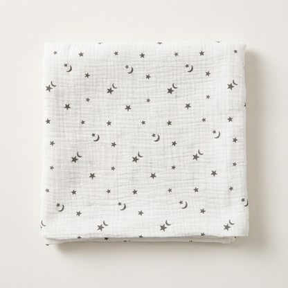 Premium organic cotton muslin swaddle blanket Northern Stars Star Moon Print folded for newborn nursery by Baby DukWear